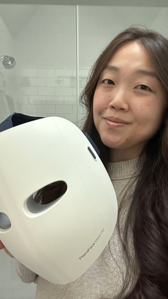 Christa Joanna Lee holding the TheraFace Mask Glo